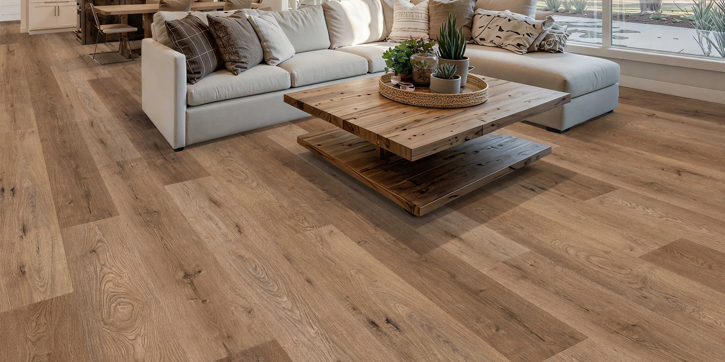 Open-plan living room with light natural-oak luxury vinyl plank flooring